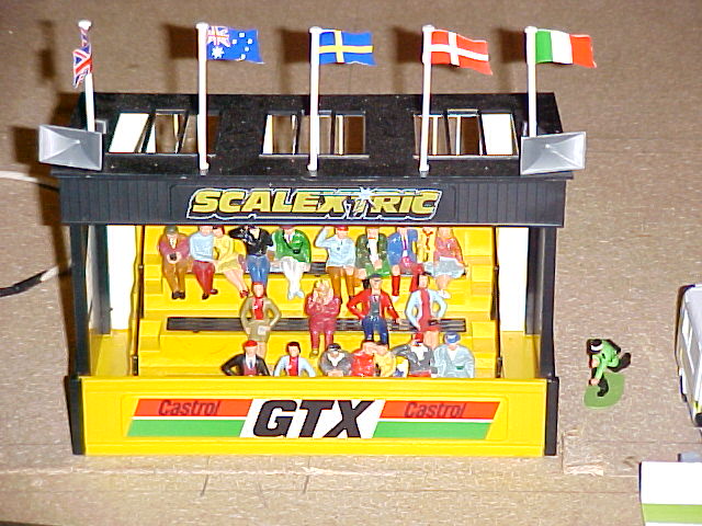 Yellow and black grandstand with painted crowd