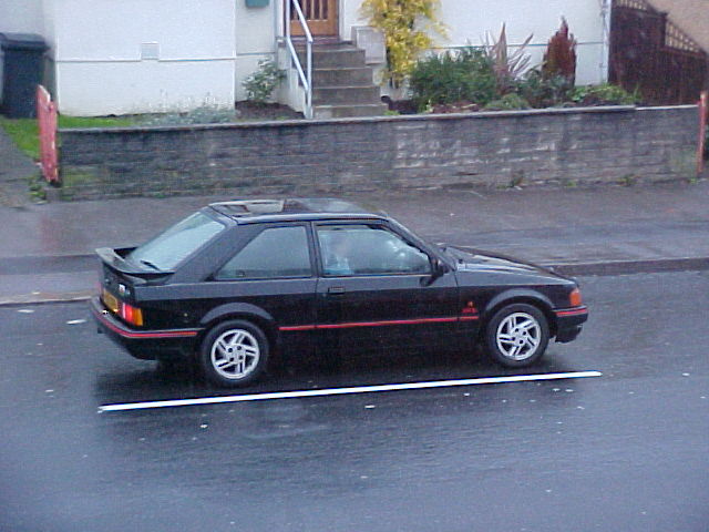 Blue Ford Escort, rear and side
