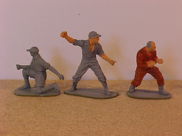 3 undercoated figures