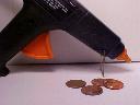 Hot glue gun and coins